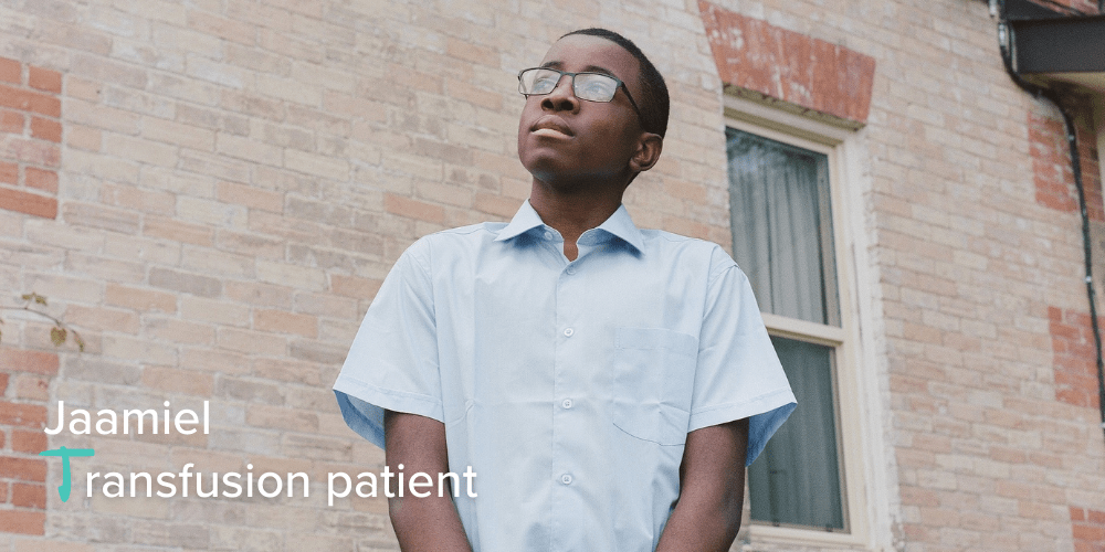 A young black boy looks up thoughtfully, with overlaid text 'Jaamiel, transfusion patient'